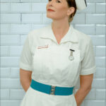 Nurse M in her crisp, white, vintage nurse's uniform