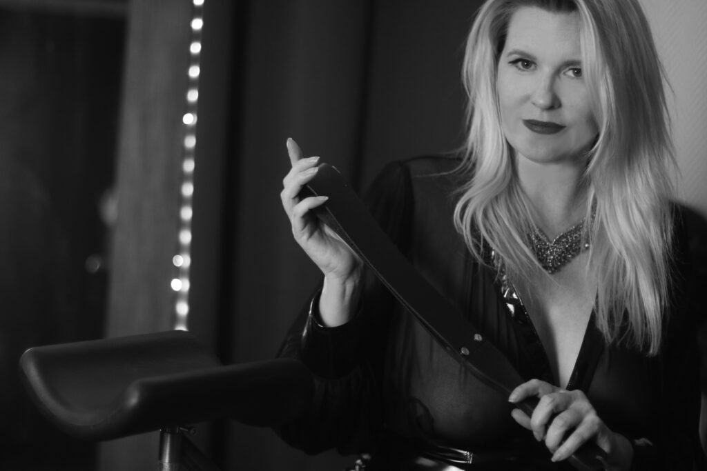 Domina M with Leather Paddle American Dominatrix in Paris, France, Domina M
